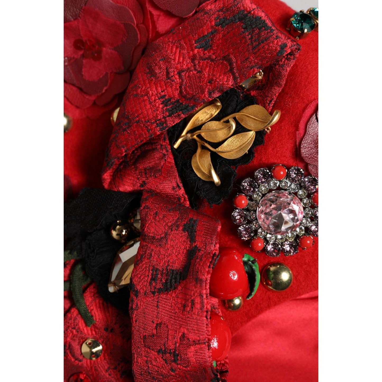 Dolce & Gabbana red cloche hat with gold rose brooch, crystal embellishments, and floral details, made in Italy.
