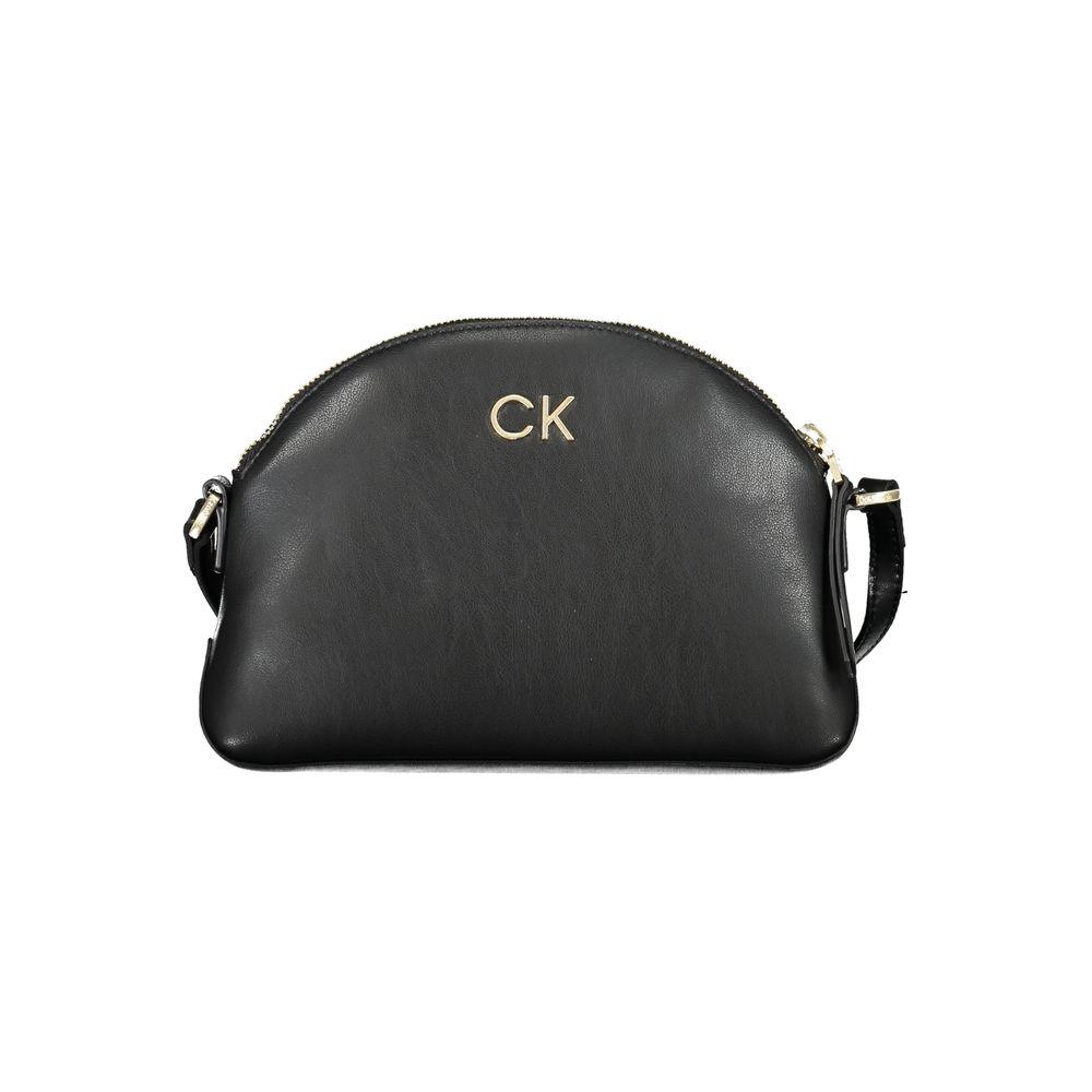 Calvin Klein black polyester handbag with adjustable strap, internal pocket, zip closure, and logo made from recycled materials.