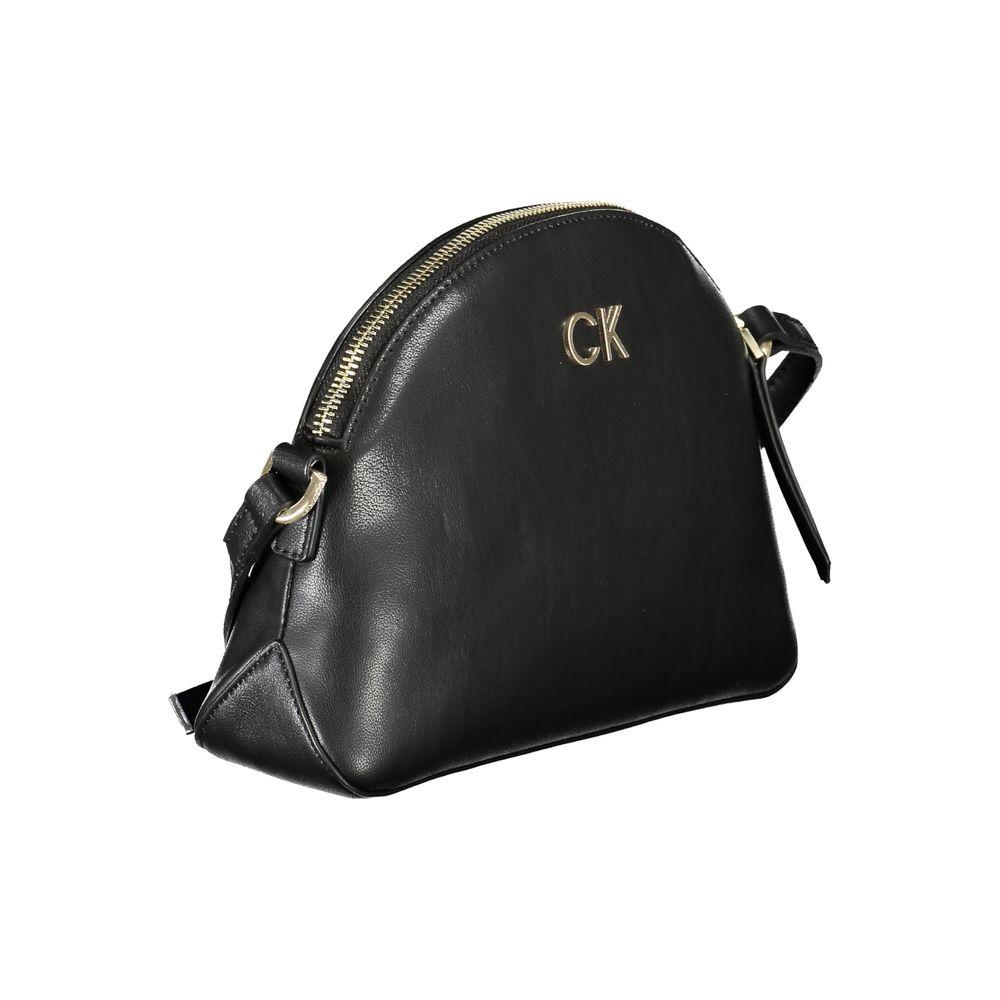 Calvin Klein black recycled polyester handbag with adjustable shoulder strap, zip closure, and logo design, featuring one internal pocket.