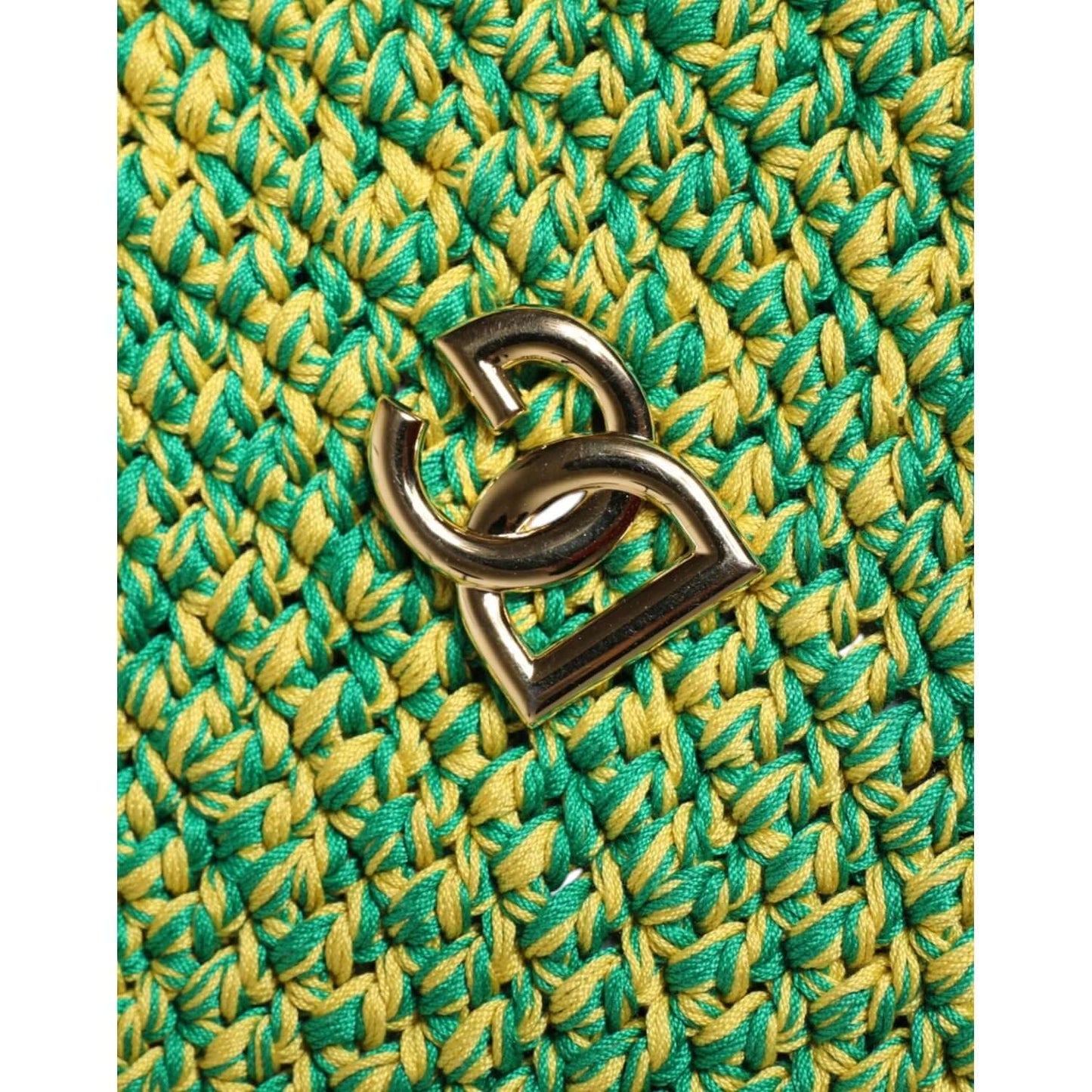 Green Dolce & Gabbana crochet bucket hat detail with gold DG logo emblem, made of 100% cotton, highlighting Italian craftsmanship.