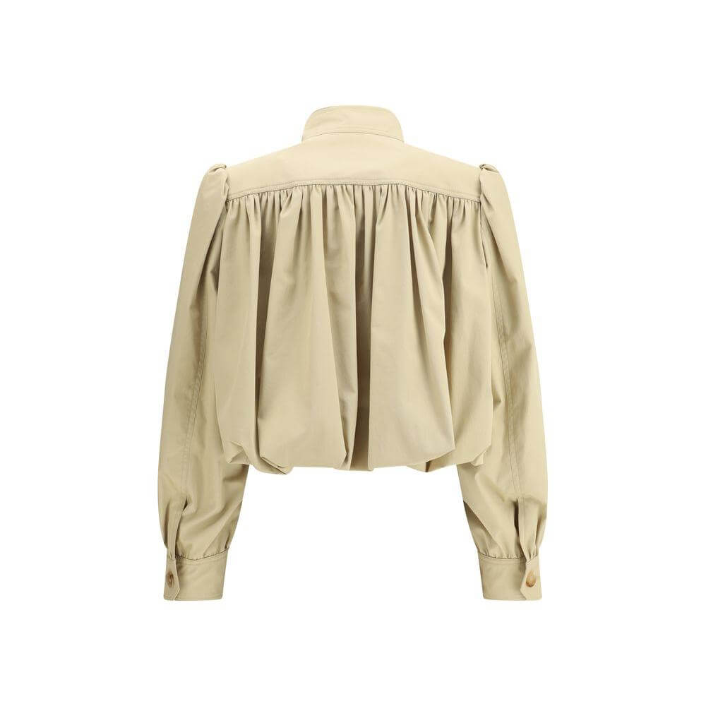 Back view of Chloé cropped cotton jacket with ruffle details and mandarin collar, showcasing its bold and modern oversized design.