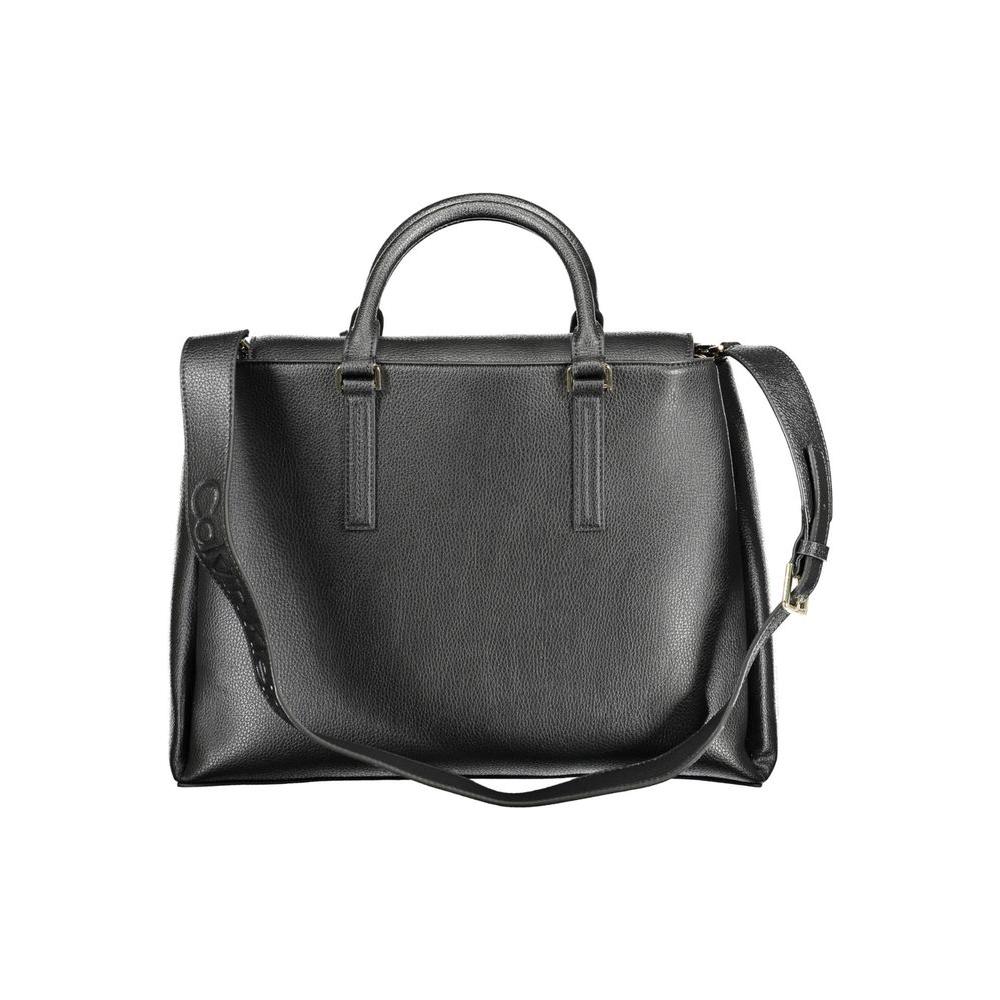 Calvin Klein black polyester women's handbag with dual handles and adjustable strap, featuring multiple compartments and a magnetic closure.