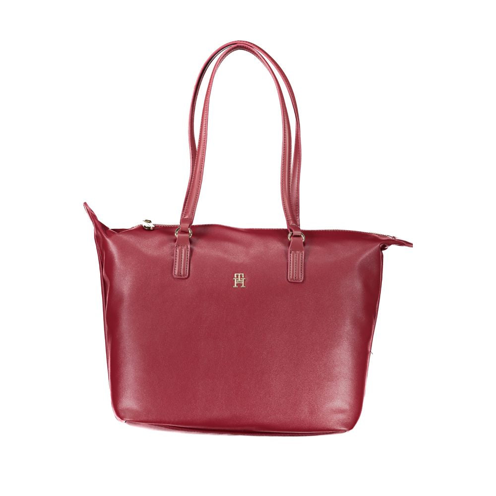Tommy Hilfiger pink polyester women's handbag with shoulder handles and zip closure, offering style and durability.