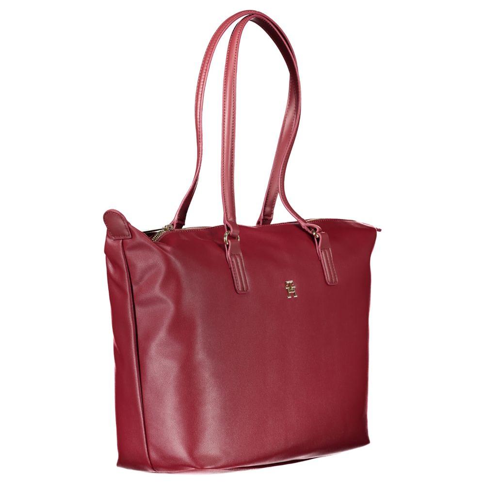 Tommy Hilfiger pink polyester women's handbag with shoulder straps and zip closure, elegant and durable design.