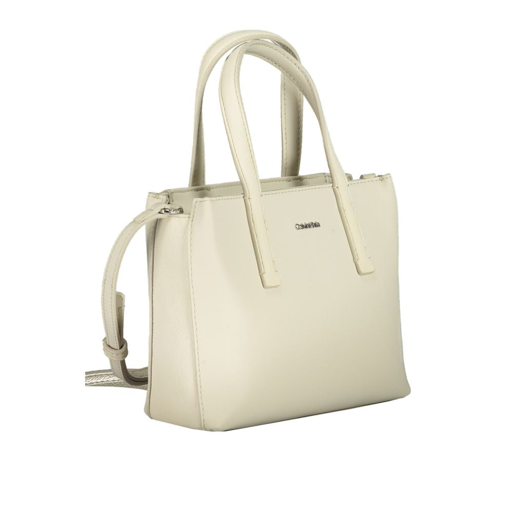 Calvin Klein beige polyester handbag with two handles, adjustable shoulder strap, internal card pocket, and zip closure.