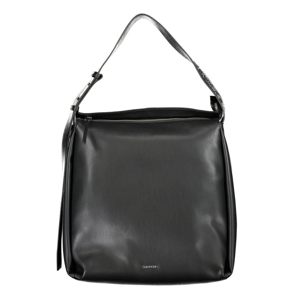 Calvin Klein black polyester handbag with adjustable shoulder strap, internal pocket, zip closure, and logo detail.