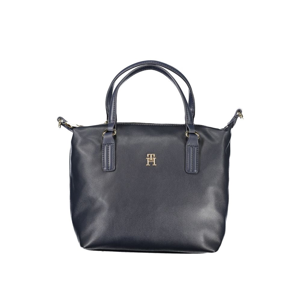 Tommy Hilfiger blue polyester handbag with dual handles, adjustable removable strap, internal pocket, zip closure, and logo on front.