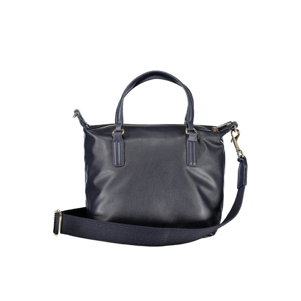 Tommy Hilfiger blue polyester handbag with two handles, adjustable shoulder strap, internal pocket, zip closure, and logo.