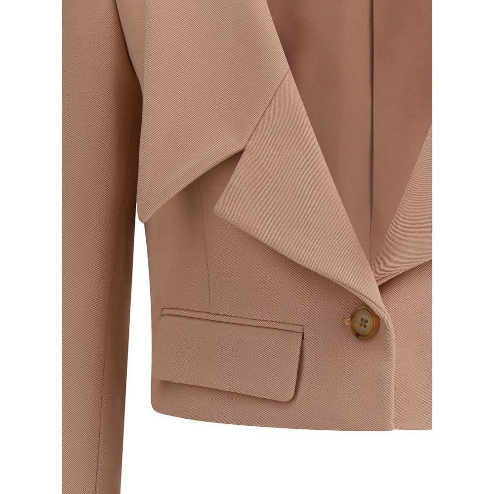 Chloé wool gabardine cropped blazer with oversized lapels, mini flap pockets, and engraved horn button for elegant style.