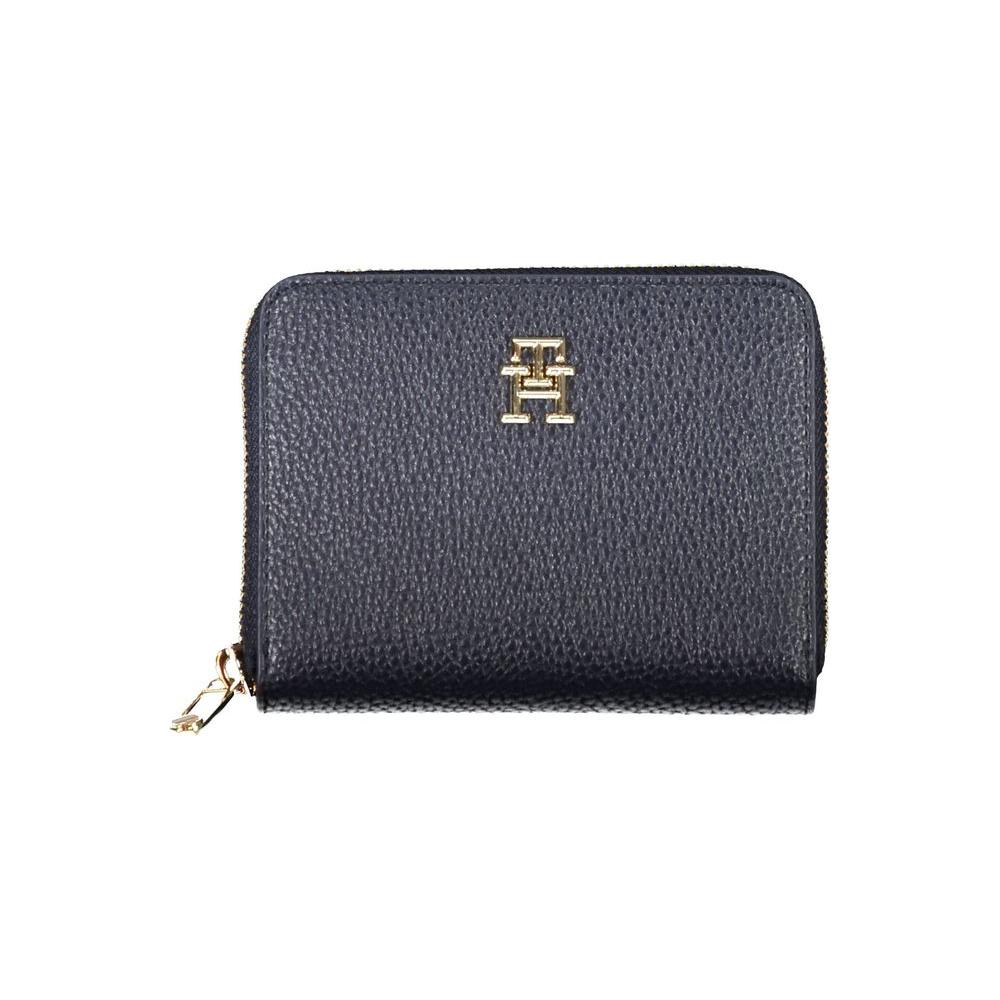 Tommy Hilfiger blue women's wallet with zip closure and gold logo, featuring five compartments and multiple card slots.