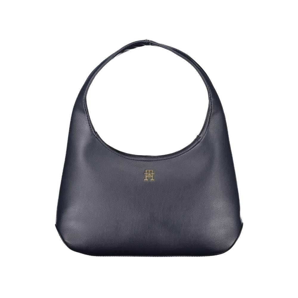 Tommy Hilfiger blue polyester handbag with a single shoulder handle, internal pocket, zip closure, and logo detail.