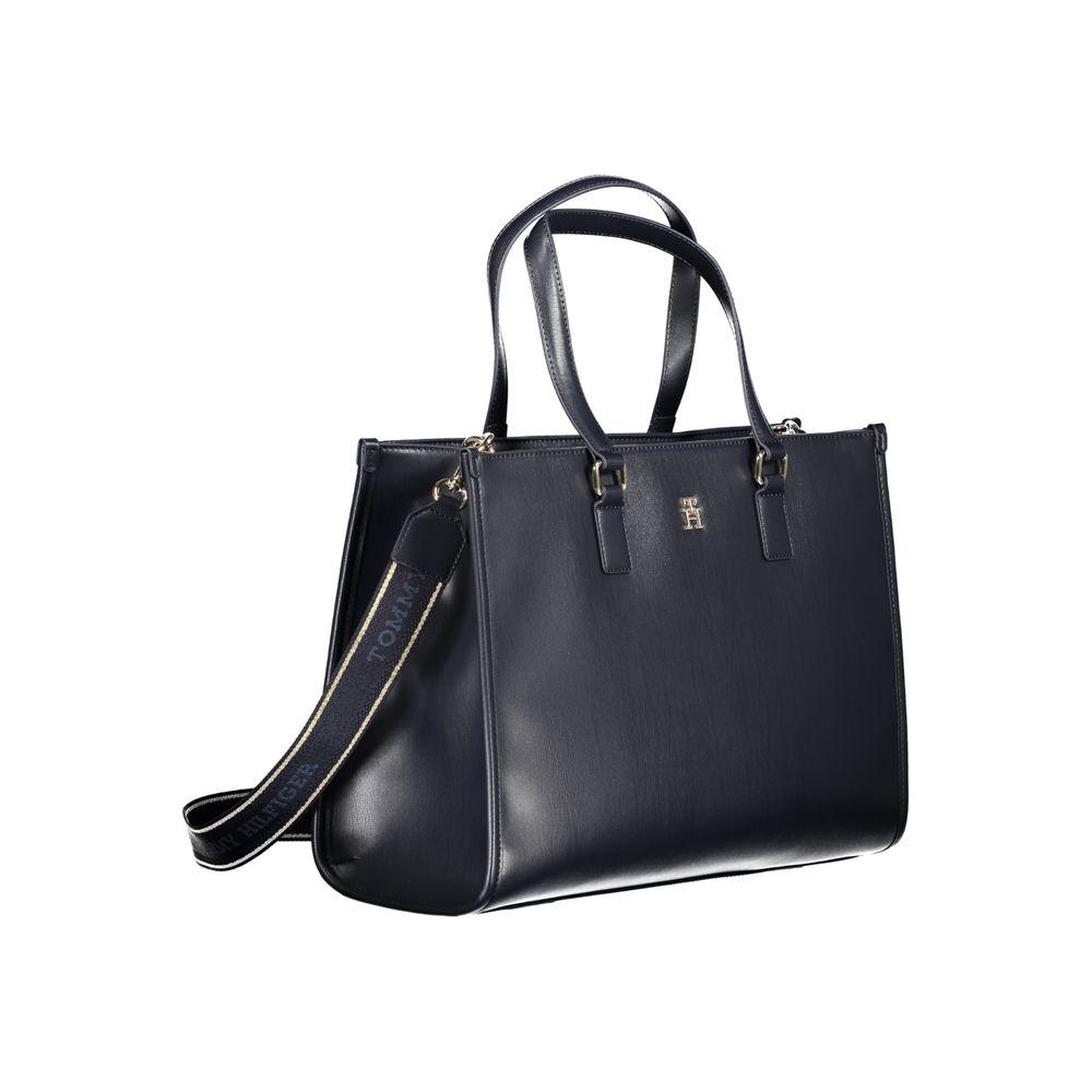 Tommy Hilfiger blue polyethylene handbag with logo, two shoulder handles, adjustable strap, internal pocket, and zip closure.