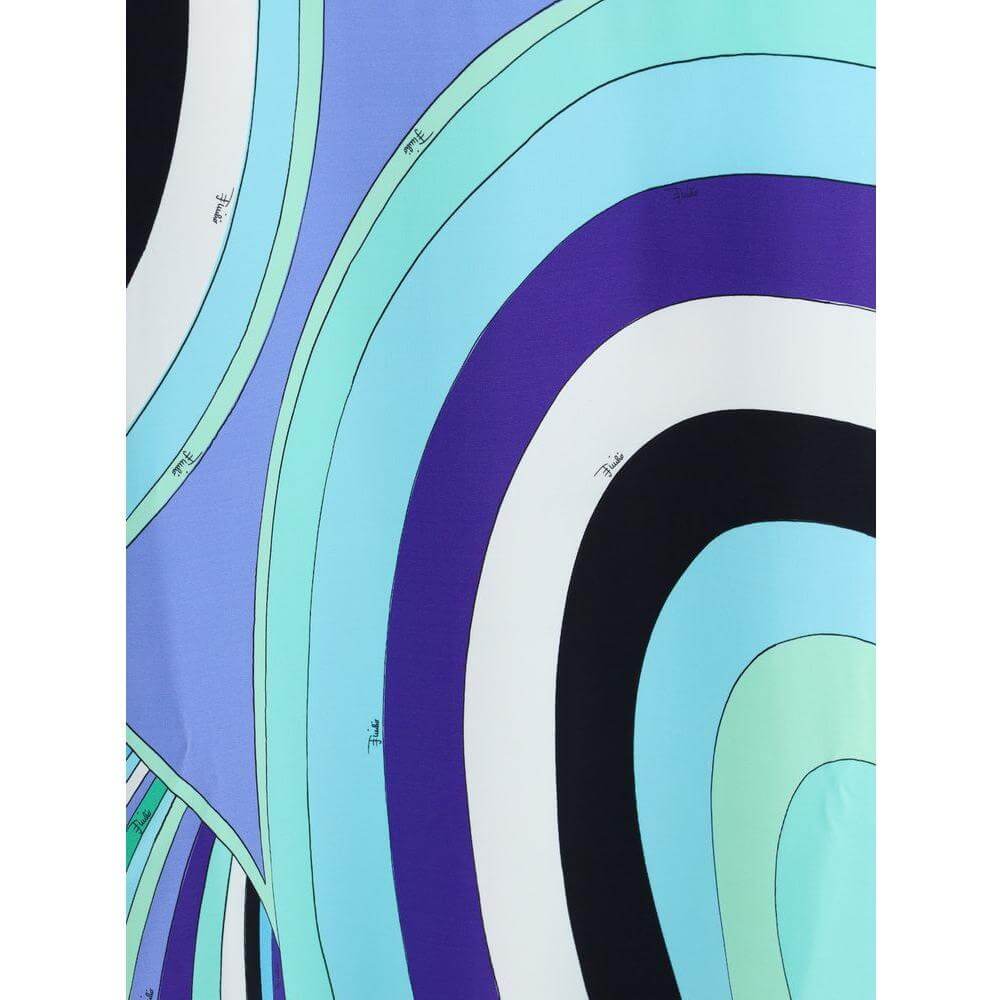Close-up of Emilio Pucci Iride print showcasing vibrant blue and purple swirling patterns on fabric.