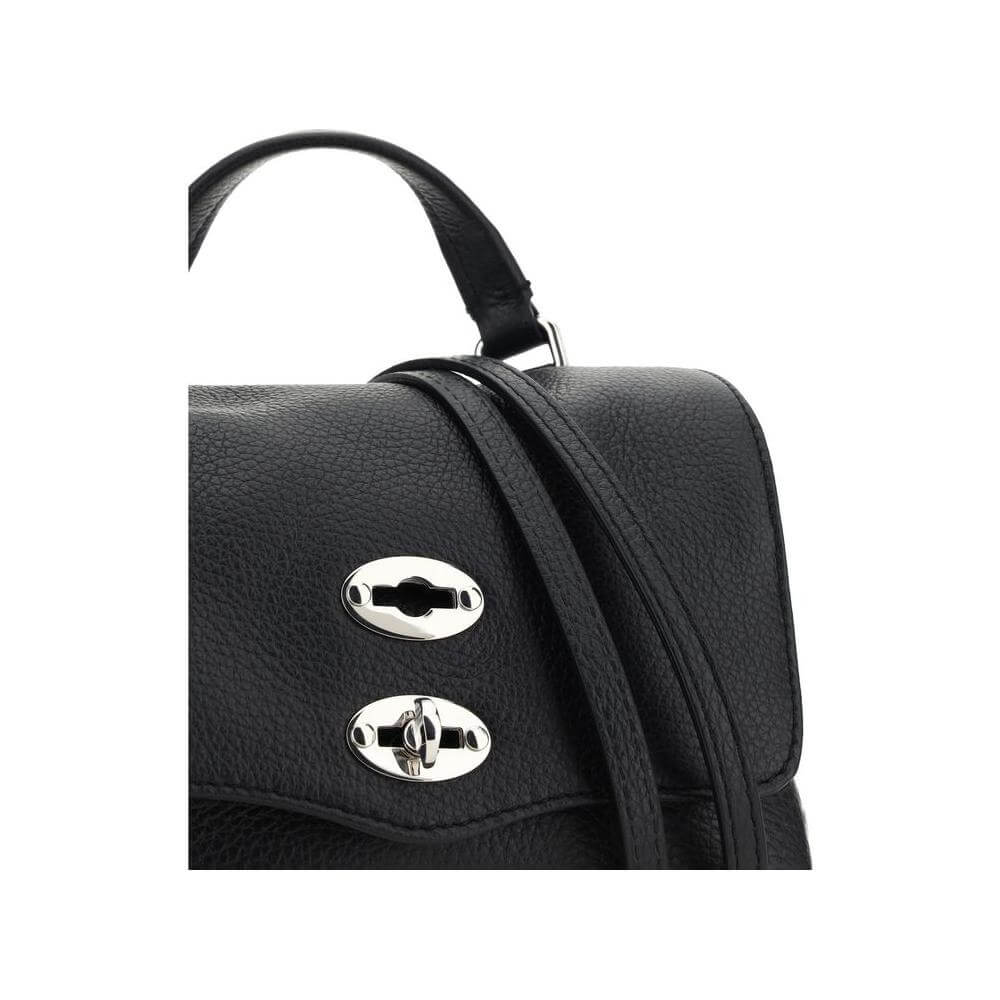 Close-up of Zanellato Postina Daily Shoulder Bag with calfskin, hook-and-eye closure, and metallic studded trim.
