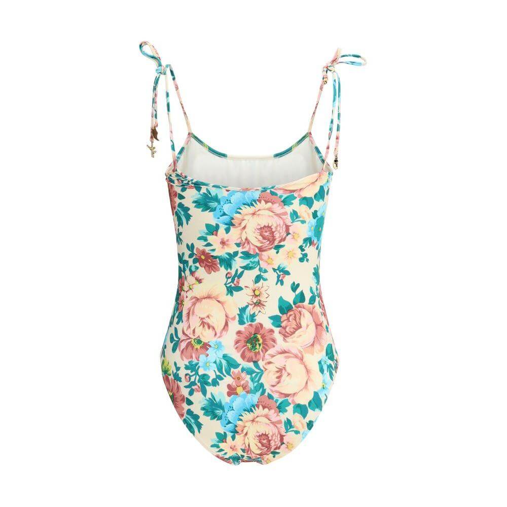 Chloé floral-print swimsuit with knotted shoulder ties and gold charms, perfect for a sophisticated and romantic summer beach look.