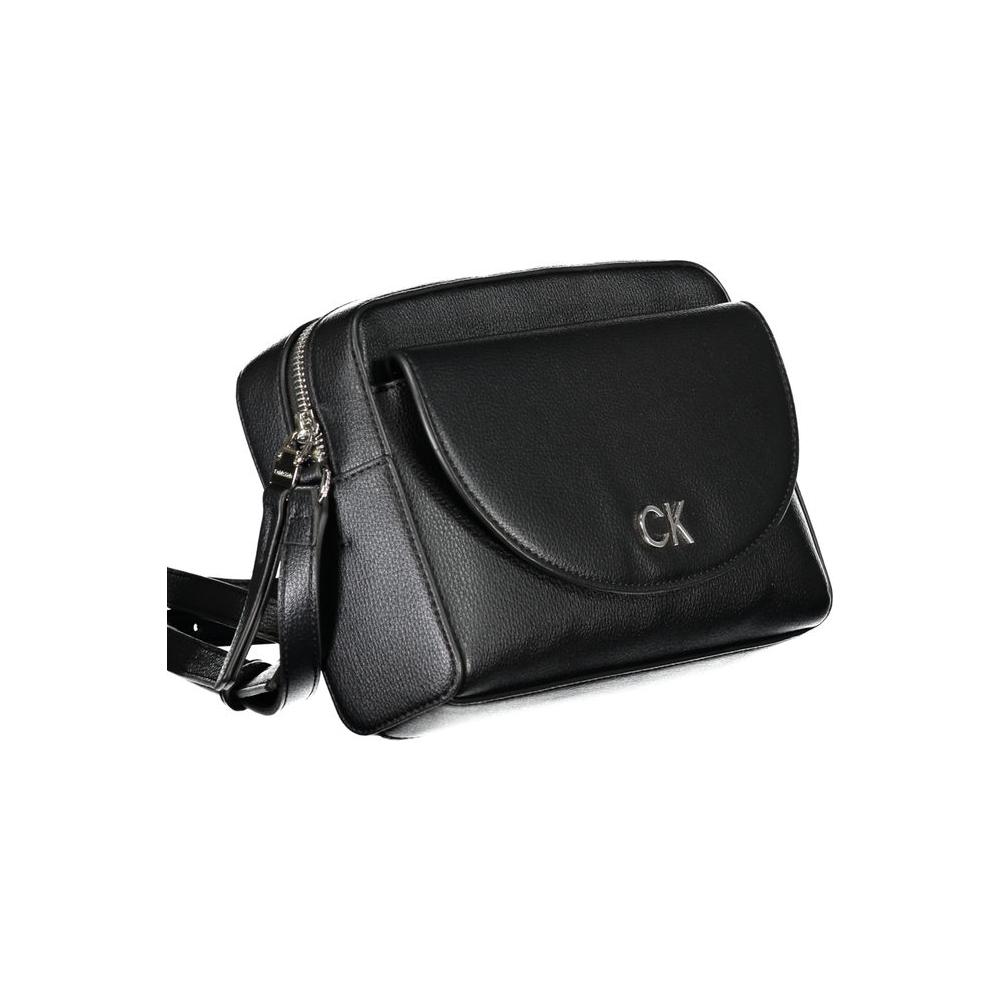 Calvin Klein black polyethylene handbag with adjustable shoulder strap, external pocket, zip closure, and embossed logo.
