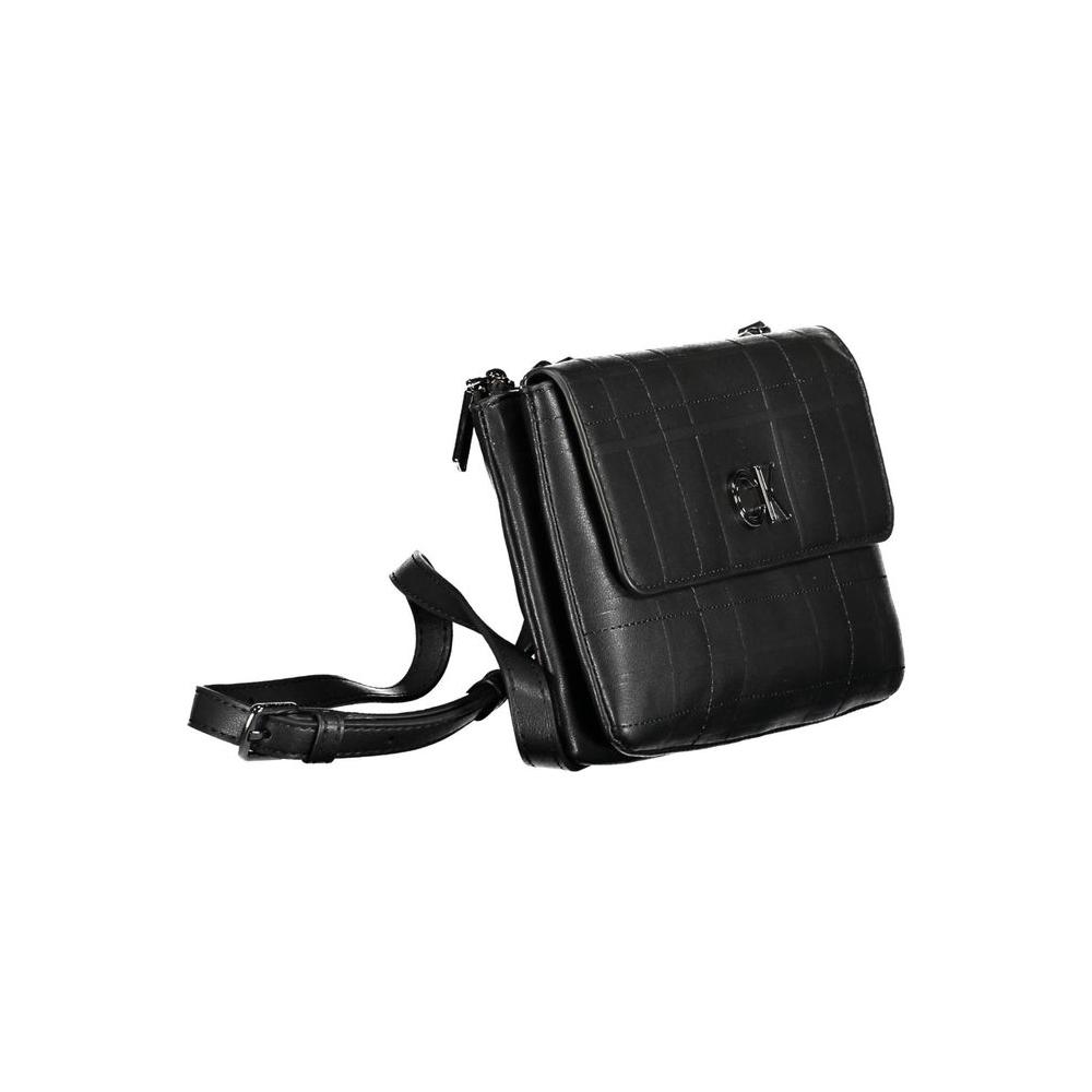 Calvin Klein black polyester women's handbag with adjustable strap and dual compartments, offering style and organization.