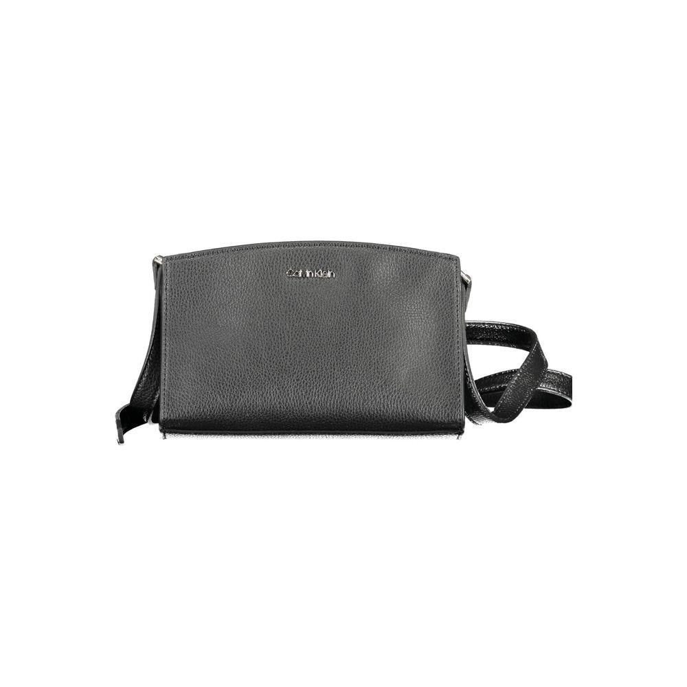 Calvin Klein black polyester women's handbag with adjustable strap and zip closure, featuring a bold logo. Chic and eco-friendly design.