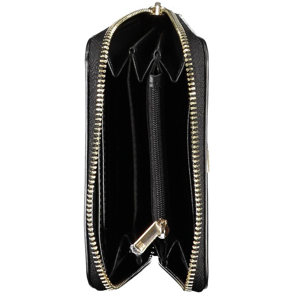 Interior view of Tommy Hilfiger black women's wallet, featuring multiple compartments and zip closure.
