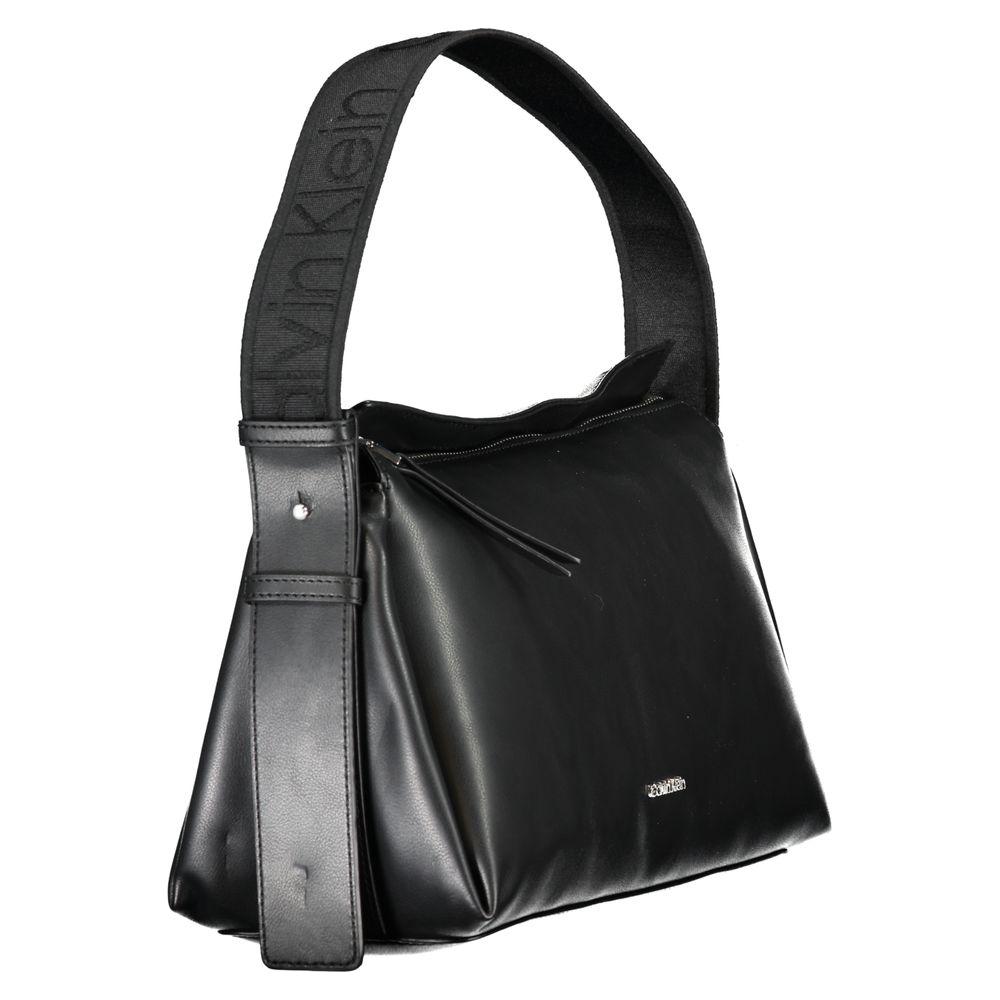 Calvin Klein black handbag with adjustable shoulder strap, zip closure, and logo, made from recycled polyester.