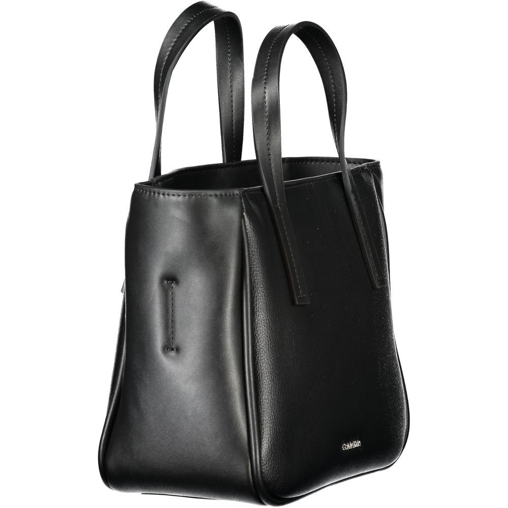 Calvin Klein black polyethylene handbag with dual handles, adjustable shoulder strap, and subtle logo detailing for versatile styling.