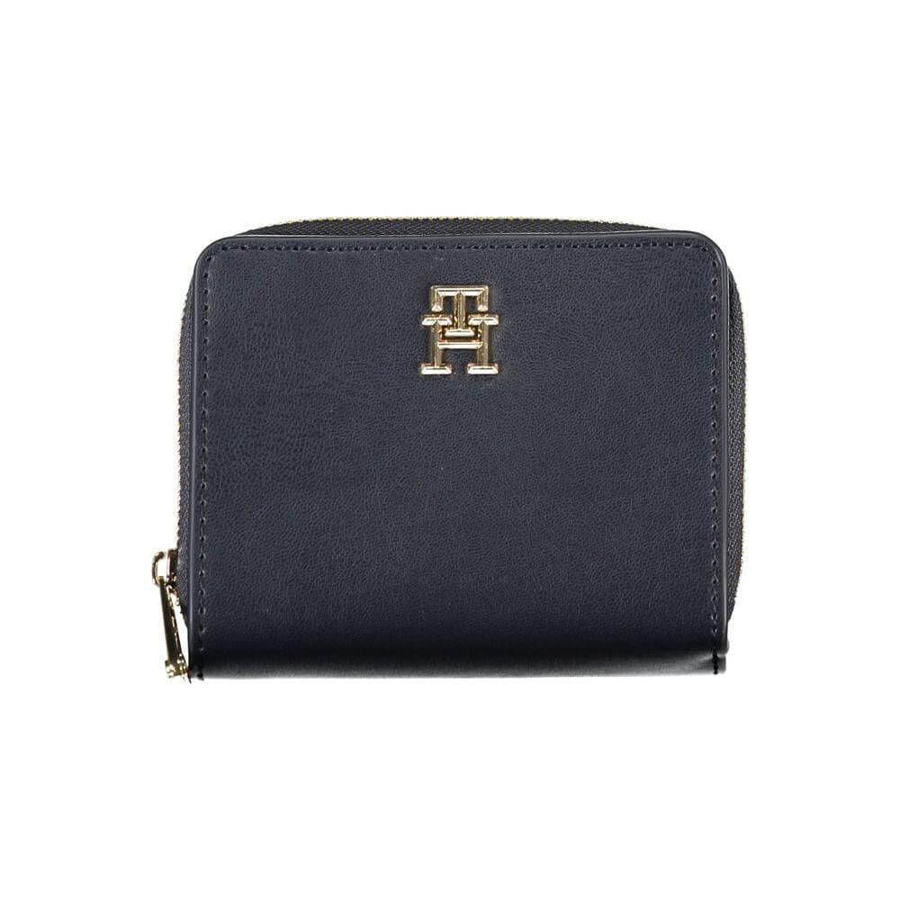 Tommy Hilfiger sleek blue polyethylene wallet with gold logo, featuring zip closure and two compartments for cards and coins.