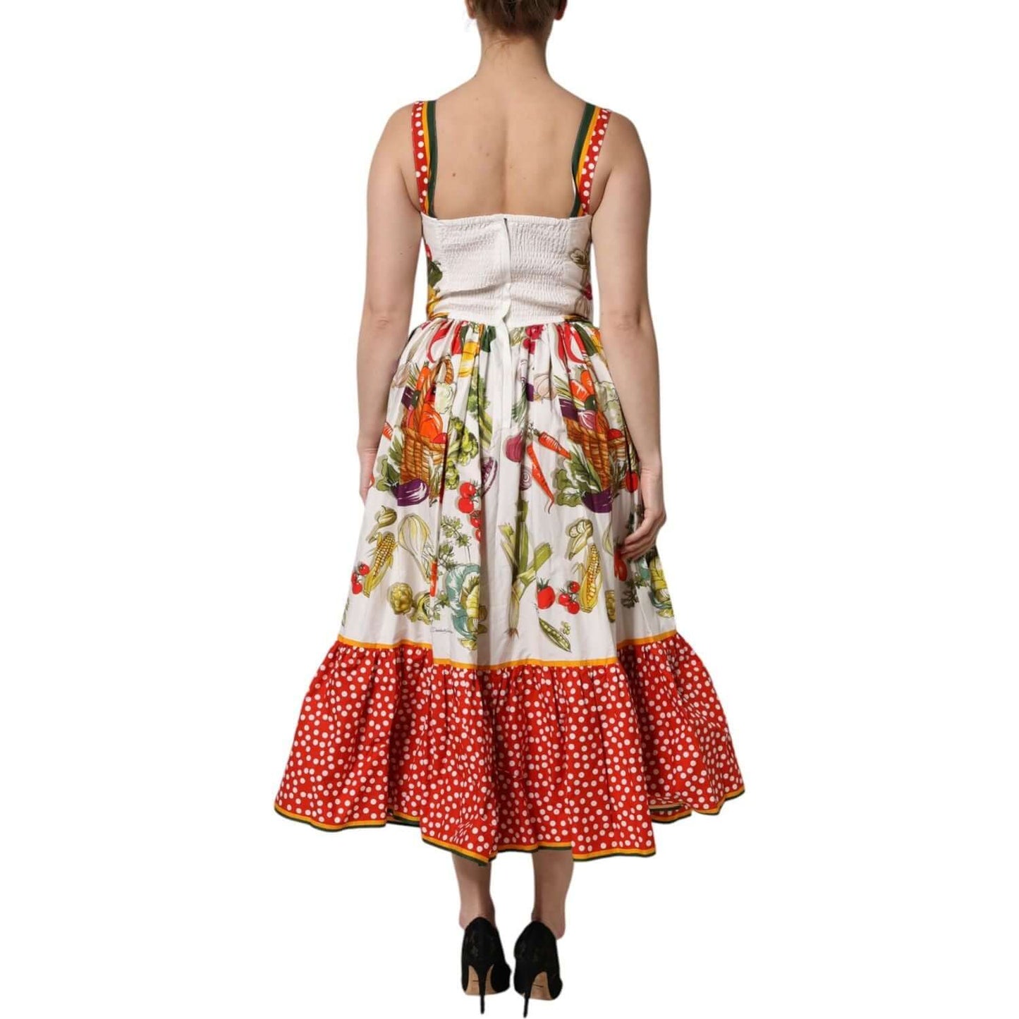 Back view of Dolce & Gabbana white vegetables sleeveless A-line dress with red polka dot hem, showcasing exclusive craftsmanship.