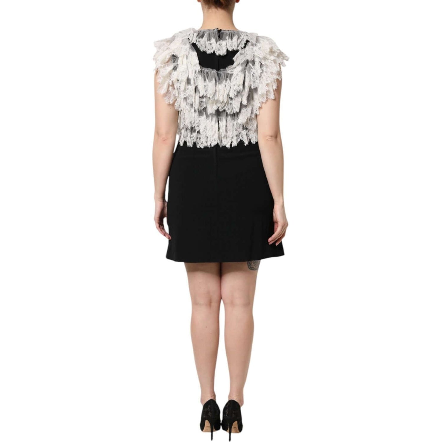 Back view of Dolce & Gabbana black mini dress with lace embellishments, showcasing exclusive Italian craftsmanship.