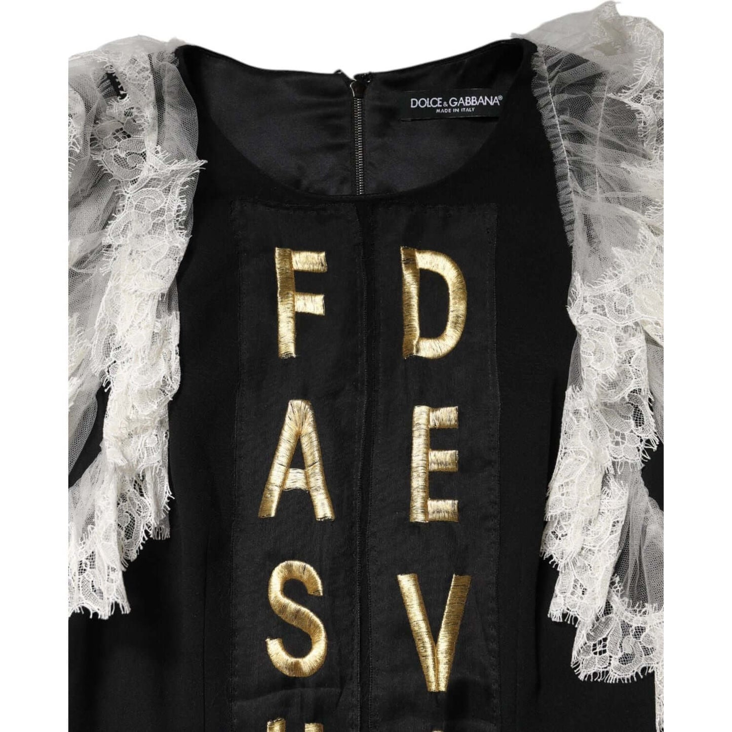 Dolce & Gabbana black mini dress with gold embellishments and lace, featuring the word 'Devotion,' showing Italian craftsmanship.
