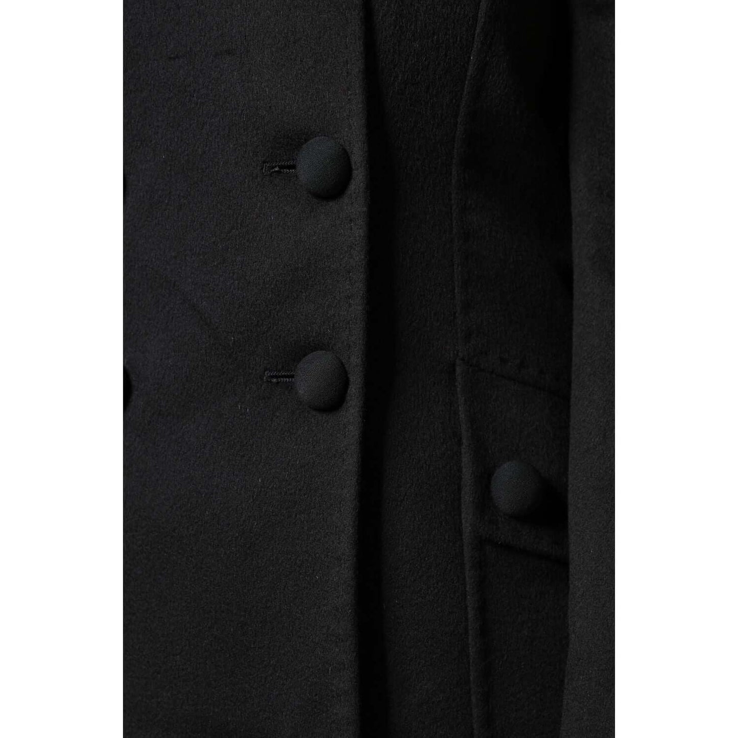 Close-up of Dolce & Gabbana black wool double-breasted blazer showcasing button details and craftsmanship.