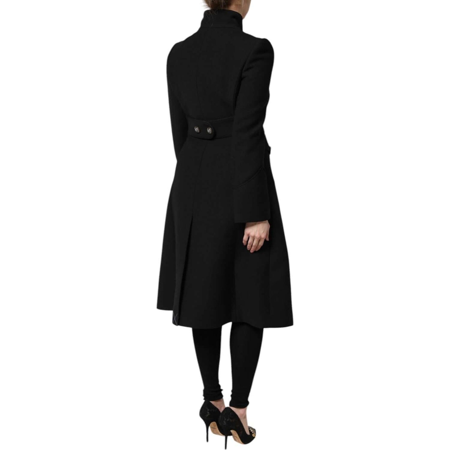 Back view of Dolce & Gabbana black wool single breasted trench coat; high craftsmanship, button closure, elegant design, made in Italy.