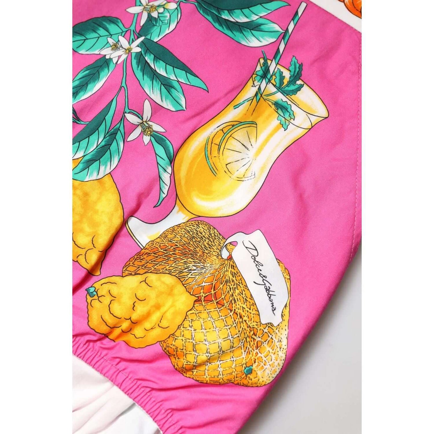 Dolce & Gabbana pink high waist hot pants with fruit print, featuring orange and green accents, crafted in Italy with exclusive design.