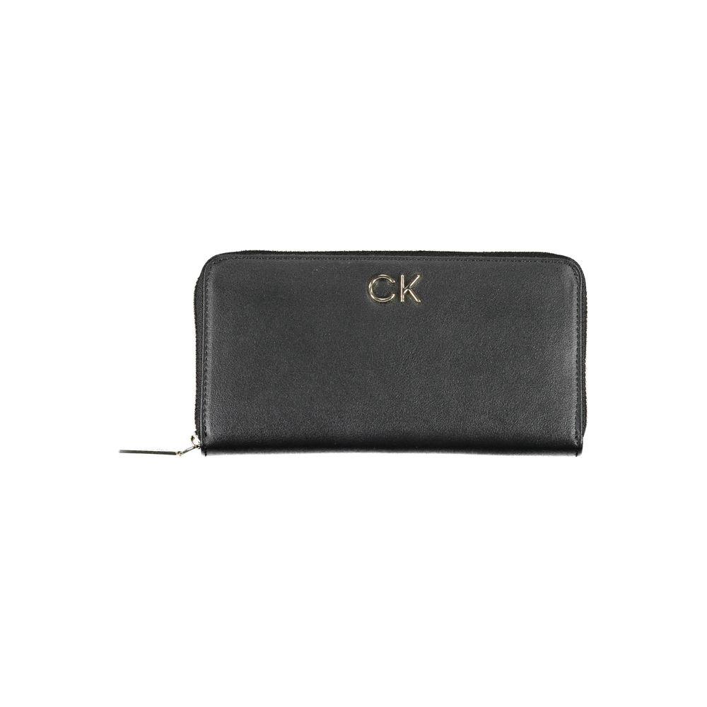 Calvin Klein black polyethylene women's wallet with zip closure and CK logo, featuring multiple compartments for card organization.