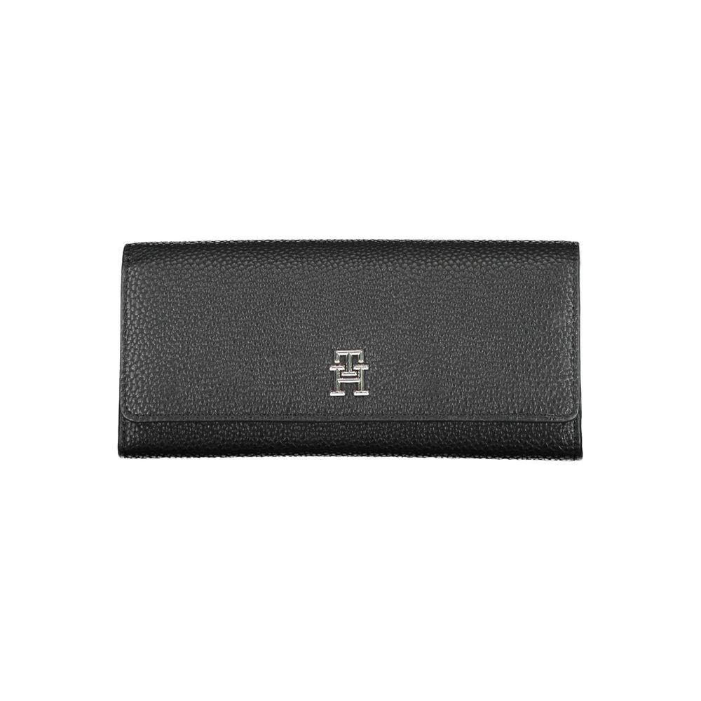 Tommy Hilfiger black polyethylene women's wallet with logo, featuring snap closure, spacious compartments, and sleek design.
