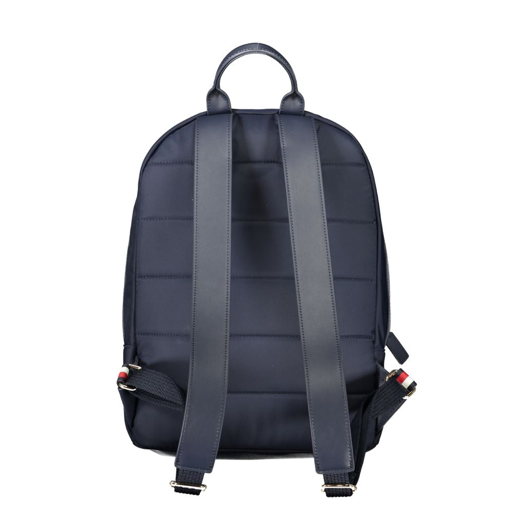 Back view of Tommy Hilfiger blue polyester backpack with adjustable straps and handle.