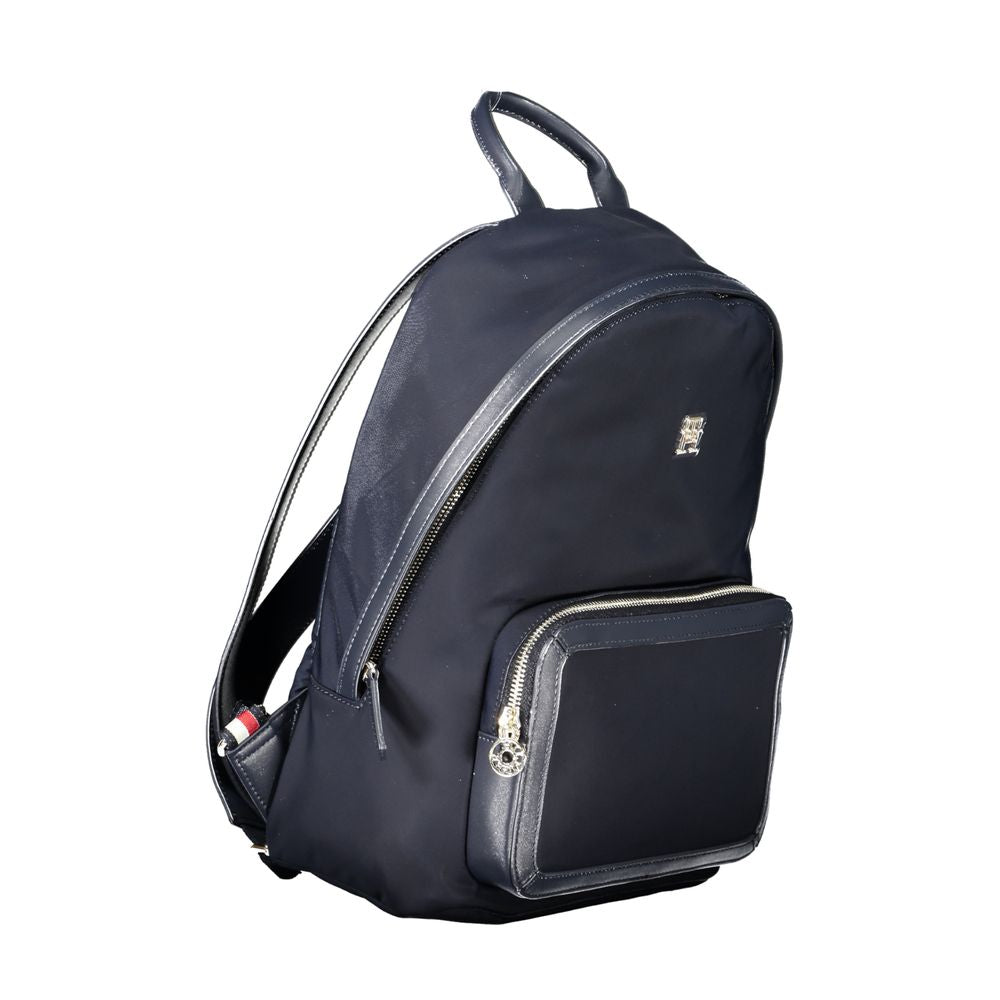 Tommy Hilfiger blue polyester backpack with 1 handle, adjustable straps, external and internal pockets, zip closure, and logo.