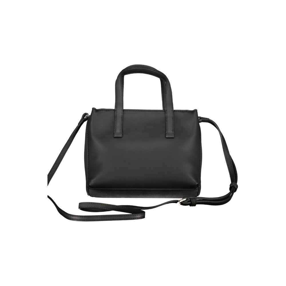 Calvin Klein black polyester handbag with two handles, adjustable shoulder strap, zip closure, and internal card pocket.