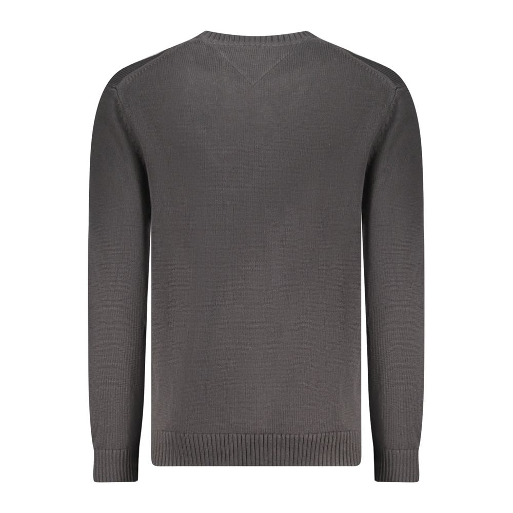 Back view of Tommy Hilfiger black cotton men's sweater showing crew neck and ribbed cuffs.