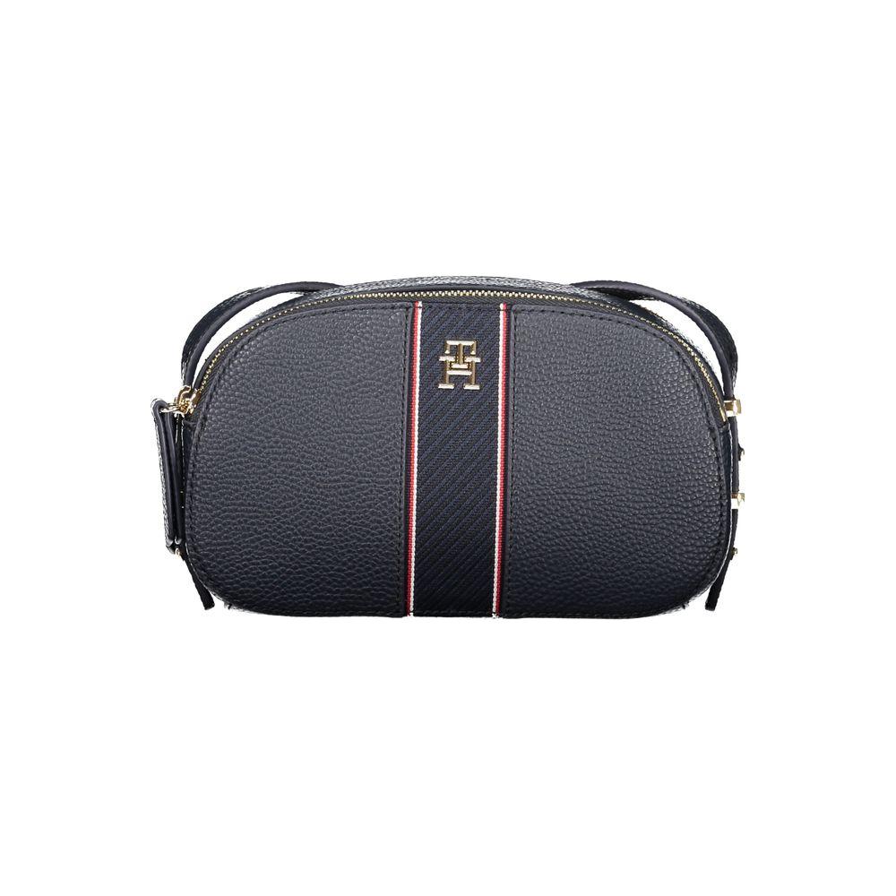 Tommy Hilfiger blue women's handbag with adjustable shoulder strap and embossed logo, featuring two compartments and sleek design.