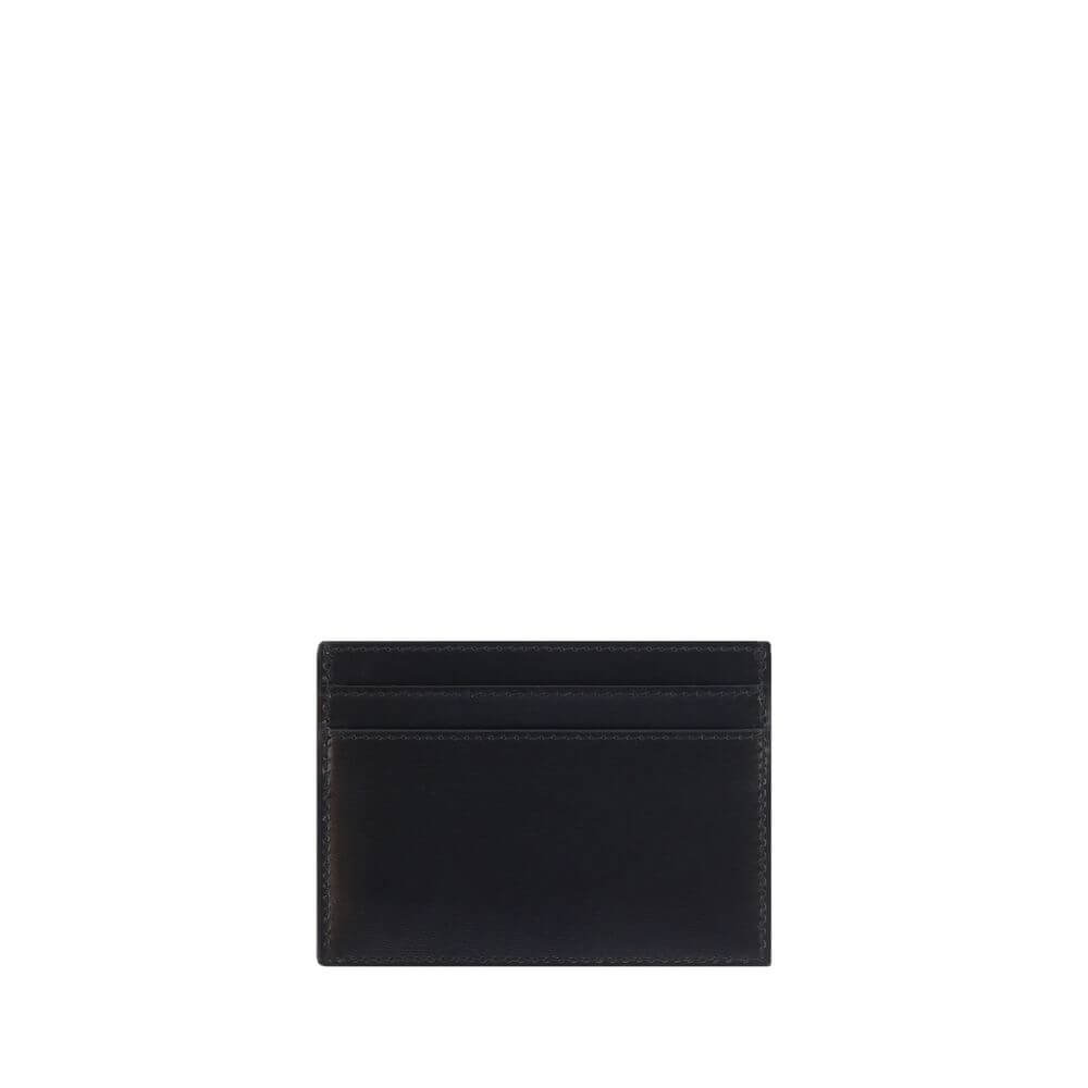 Saint Laurent Black Calf Leather Bos Taurus Wallet with card slots and embossed brass logo, 100% calf leather, AW25 season, 12x12 cm dimensions.