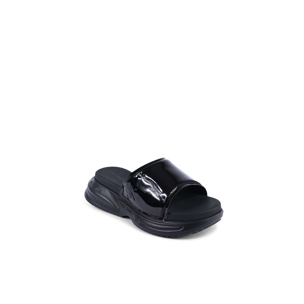Calvin Klein Black Polyurethane Slides for women, model YW0YW014040GT, with sleek design made from 100% thermoplastic polyurethane.