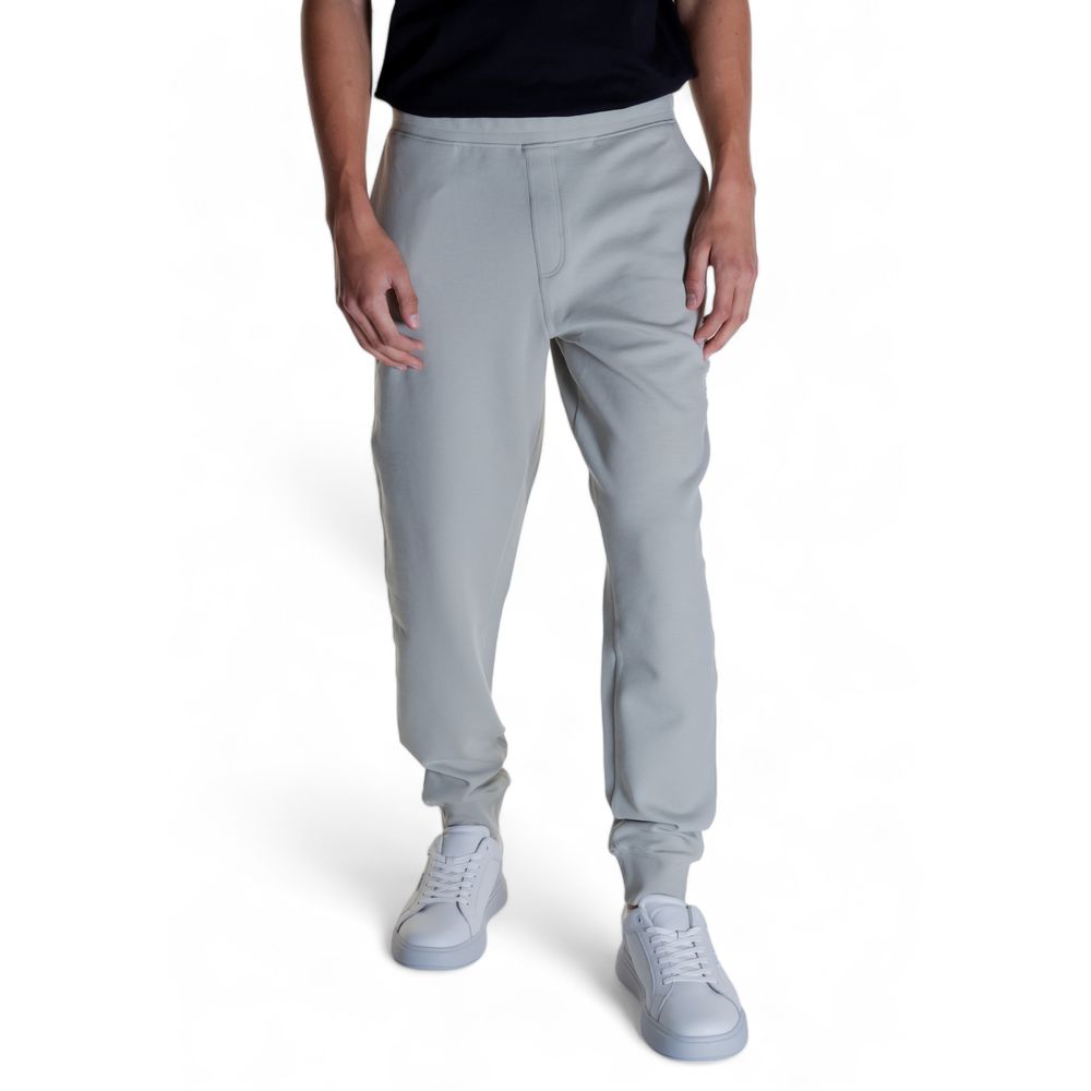 Calvin Klein Gray Cotton Joggers (Workout Pants) shown worn by a person, highlighting modern design, comfort, and versatility.