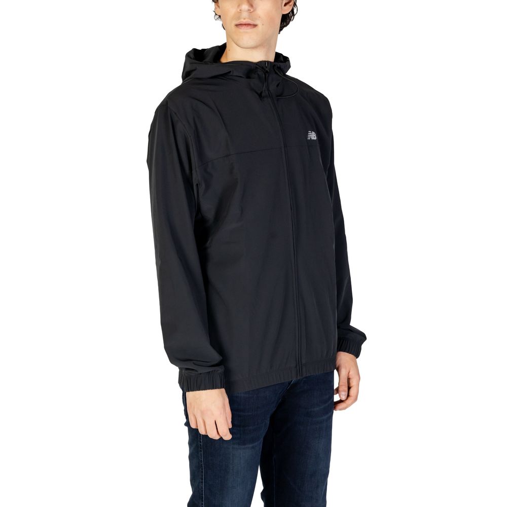 Man wearing New Balance Black Recycled Polyester Shell Jacket with hood and zipper