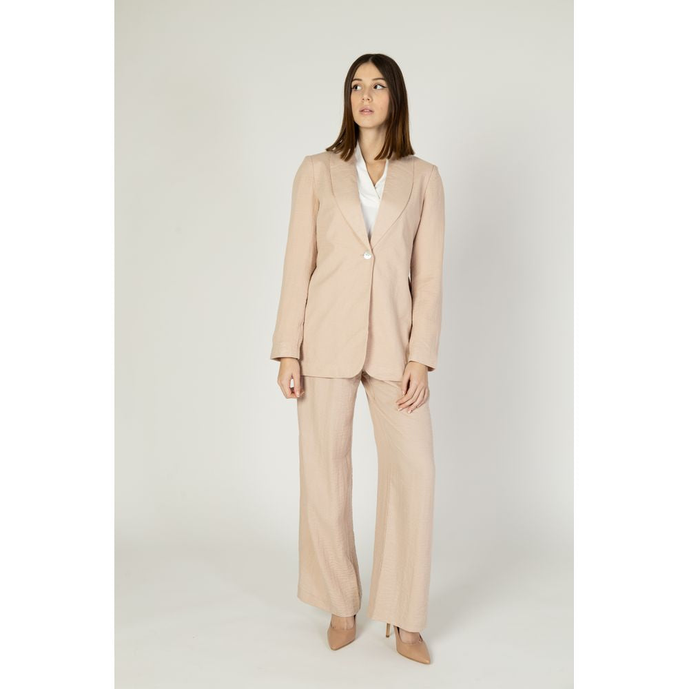 Woman wearing Vero Moda Pink Viscose Blazer with matching pants, showcasing elegant design and modern silhouette.