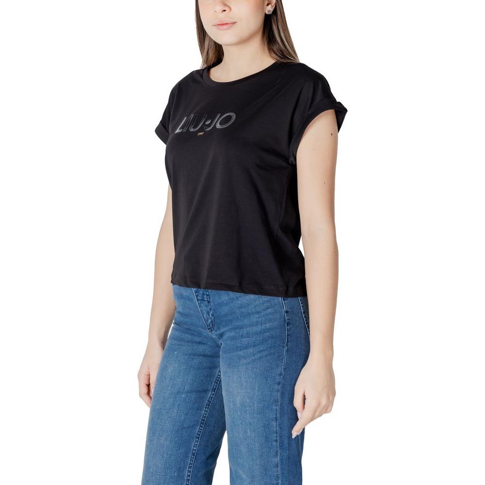 Woman wearing Liu Jo black cotton t-shirt with short sleeves and jeans, offering a casual yet elegant look.