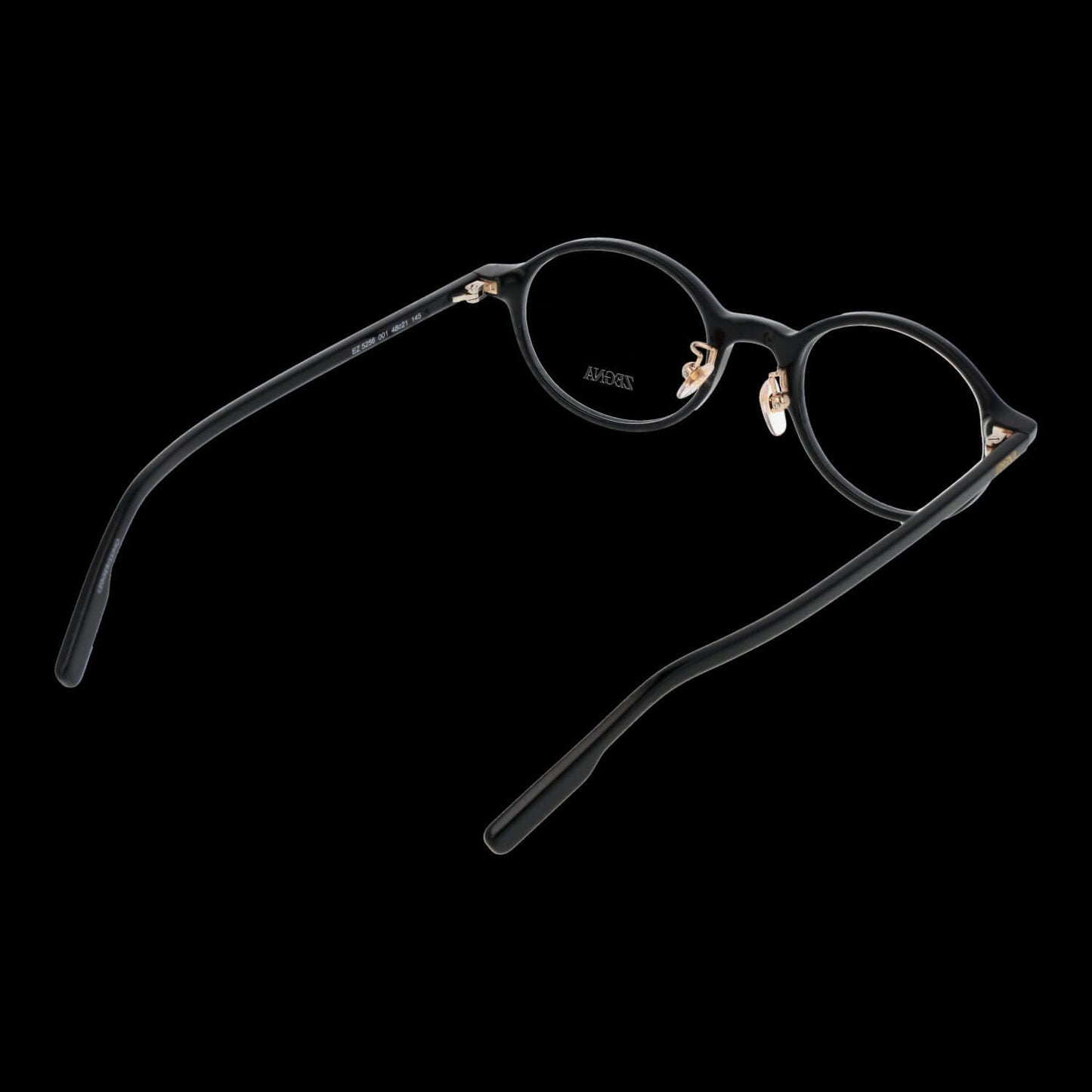 Gent's eyeglasses ERMENEGILDO ZEGNA MOD. EZ5256 48001 with round black frames and gold accents on a dark background.