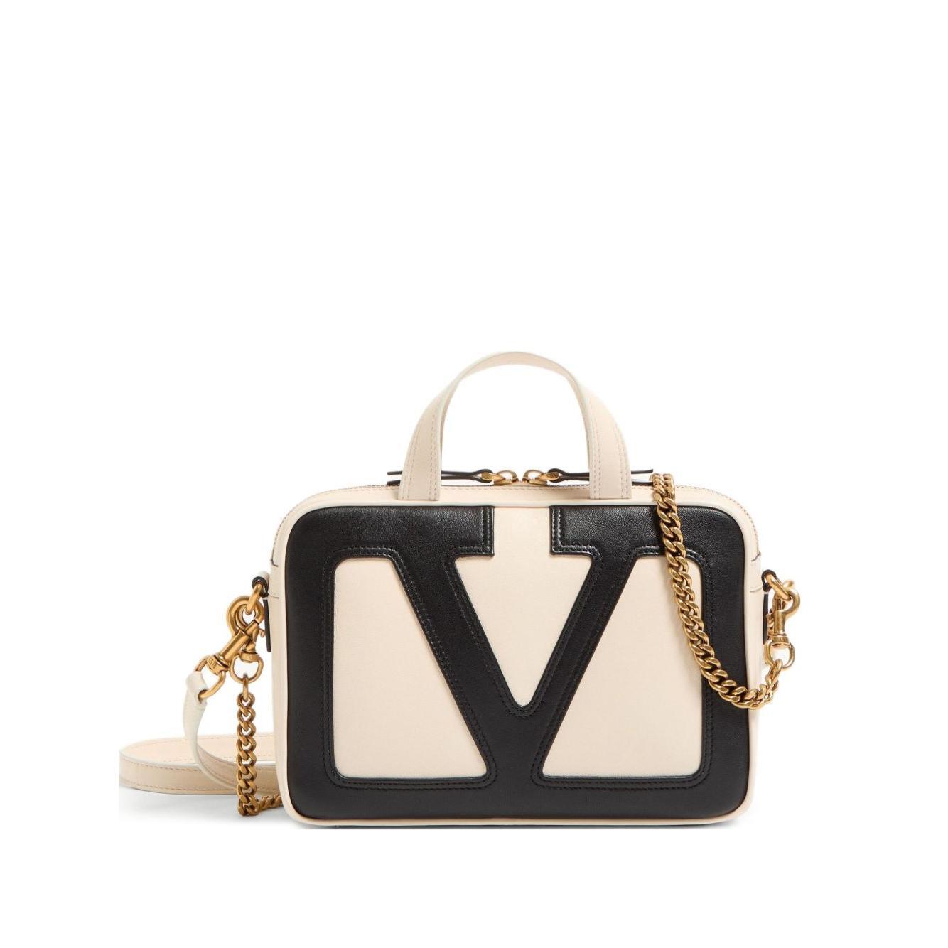 Front view with bag zipped and handles upright.