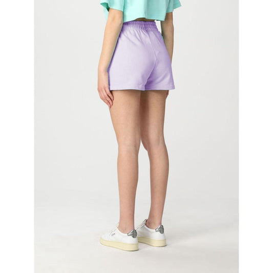 Model wearing Pharmacy Industry purple cotton shorts, showcasing back design with logo. Made in Italy. Perfect for chic casual style.