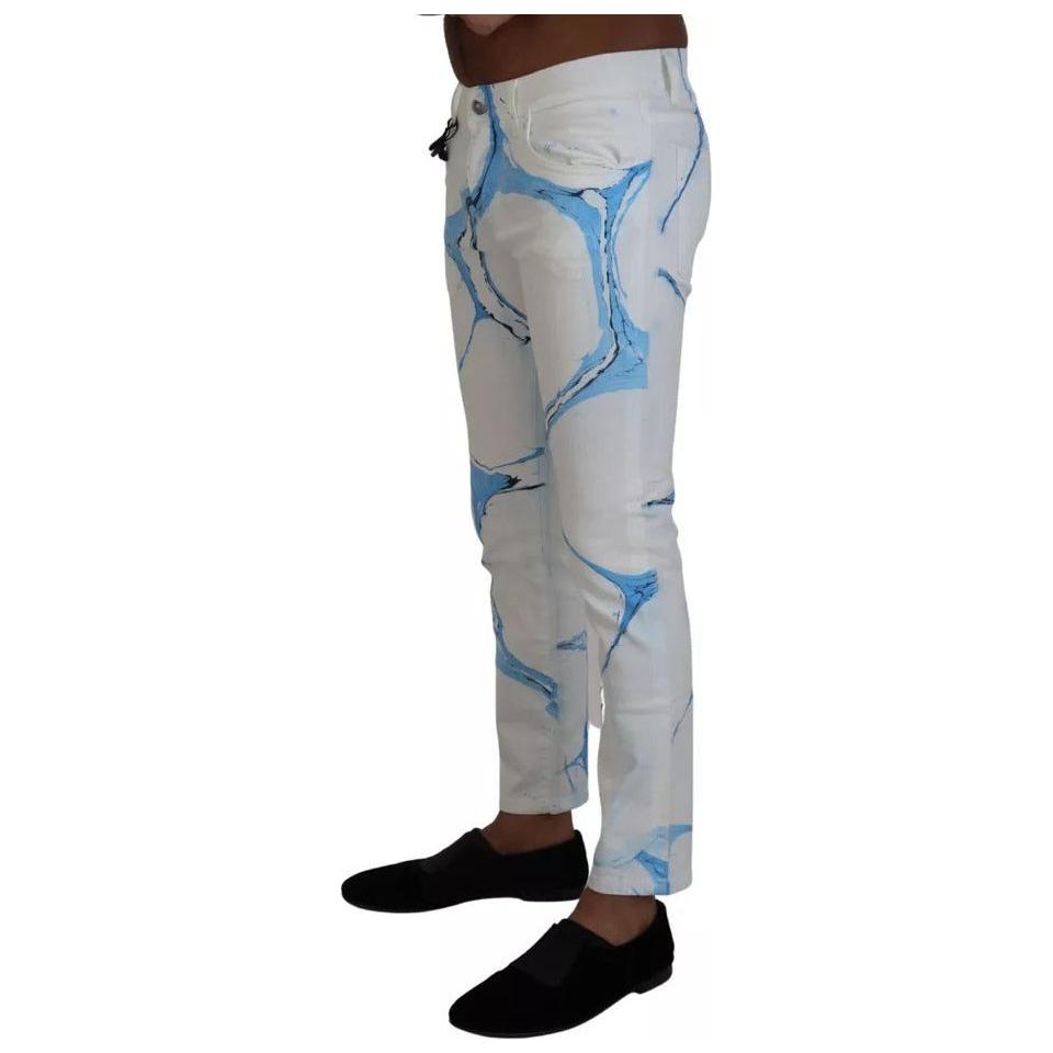 بنطلون جينز ضيق من القطن باللون الأبيض والأزرق من دولتشي آند غابانا