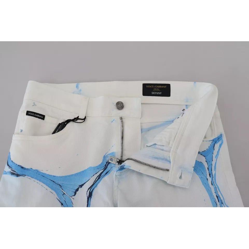 بنطلون جينز ضيق من القطن باللون الأبيض والأزرق من دولتشي آند غابانا